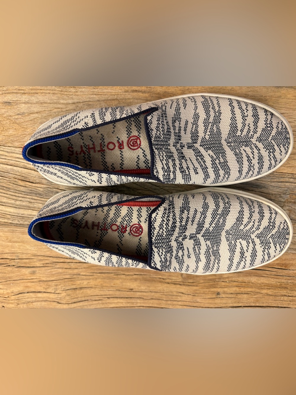 Rothy's Slip-On Knit Sneakers in Ivory and Navy with Red Accents